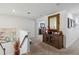 Upstairs hallway with mirror and storage cabinet at 720 Split Hoof Dr, Saint Cloud, FL 34771