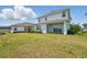 A spacious backyard and covered patio with sliding glass doors enhances this home's appeal at 13163 Mcmillan Dr, Orlando, FL 32827