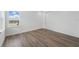 Bedroom with wood-look flooring, a closet, and window view at 13163 Mcmillan Dr, Orlando, FL 32827