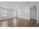 Spacious bedroom with wood floors, neutral walls, and windows for natural light at 13163 Mcmillan Dr, Orlando, FL 32827