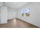 Bright bedroom with wood floor, a glass door and two windows offering natural light at 13163 Mcmillan Dr, Orlando, FL 32827