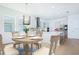 Bright kitchen and dining area features modern fixtures, and stainless steel appliances at 13163 Mcmillan Dr, Orlando, FL 32827