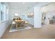 Open concept dining room with wood floors and a large window for natural light at 13163 Mcmillan Dr, Orlando, FL 32827