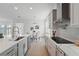 Modern kitchen featuring stainless steel appliances, quartz countertops, and tiled backsplash at 13163 Mcmillan Dr, Orlando, FL 32827