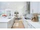 The gourmet kitchen features modern appliances, a stylish tile backsplash, and an adjacent dining area with natural light at 13163 Mcmillan Dr, Orlando, FL 32827