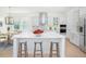 Bright kitchen features a large center island, stainless steel appliances and a tile backsplash at 13163 Mcmillan Dr, Orlando, FL 32827