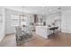 Spacious open-concept kitchen featuring stainless steel appliances and adjacent dining area at 13163 Mcmillan Dr, Orlando, FL 32827