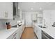 Bright kitchen featuring stainless steel appliances, sleek cabinetry, and wood flooring at 13163 Mcmillan Dr, Orlando, FL 32827