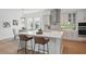 Bright kitchen with a large center island, stainless steel appliances, and breakfast bar seating at 13163 Mcmillan Dr, Orlando, FL 32827