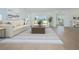 Inviting living room boasts natural light and stylish decor with a large window view to the outdoor scenery at 13163 Mcmillan Dr, Orlando, FL 32827