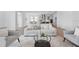 Modern living room with ample seating, wood floors, and views into the open-concept kitchen at 13163 Mcmillan Dr, Orlando, FL 32827
