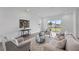 Bright living room with large sliding doors, hardwood floors, and neutral tones at 13163 Mcmillan Dr, Orlando, FL 32827