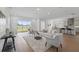 Open-concept living room with sliding glass doors leading to the backyard, and easy access to kitchen at 13163 Mcmillan Dr, Orlando, FL 32827