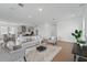 Bright living room featuring modern furnishings, hardwood floors, and recessed lighting at 13163 Mcmillan Dr, Orlando, FL 32827