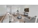 Comfortable living room with stylish furniture, hardwood floors, and neutral tones at 13163 Mcmillan Dr, Orlando, FL 32827