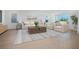 Bright living room with contemporary decor, large windows, and comfortable seating at 13163 Mcmillan Dr, Orlando, FL 32827