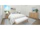 Cozy bedroom offers ample natural light, neutral color palette, and closet space at 13163 Mcmillan Dr, Orlando, FL 32827