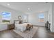 Inviting main bedroom with plenty of natural light and laminate flooring at 13163 Mcmillan Dr, Orlando, FL 32827