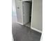 Carpeted hallway with access to bathroom and bedroom at 151 E Washington St # 604, Orlando, FL 32801