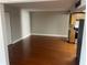 Living room with hardwood floors and kitchen view at 151 E Washington St # 604, Orlando, FL 32801