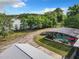 Aerial view showing house, pool, lake and landscape at 226 Mitnik Dr, Deltona, FL 32738
