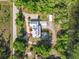Aerial view showing home, pool, detached garage, and waterfront access at 226 Mitnik Dr, Deltona, FL 32738