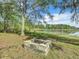 Landscaped fire pit area by the lake at 226 Mitnik Dr, Deltona, FL 32738