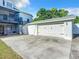 Attached garage with driveway and spiral stairs at 226 Mitnik Dr, Deltona, FL 32738