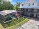 Enclosed pool area with patio and spacious two-story house at 226 Mitnik Dr, Deltona, FL 32738
