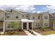 Townhome with well-maintained landscaping, neutral toned stucco, and stone accents at 2709 Scrapbook St, Kissimmee, FL 34746