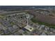 Aerial view of a well-organized residential area with homes neatly arranged and highlighted property lines at 1103 Epson Oaks Way, Orlando, FL 32837