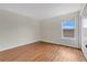 Bright bedroom featuring hardwood floors and a closet at 1103 Epson Oaks Way, Orlando, FL 32837