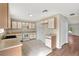 Functional kitchen with white cabinets and appliances and lots of counter space at 1103 Epson Oaks Way, Orlando, FL 32837