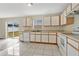 Bright kitchen featuring white appliances, ample counter space, and tile flooring at 1103 Epson Oaks Way, Orlando, FL 32837
