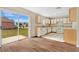 Bright kitchen featuring white appliances, ample counter space, and sliding glass door to the backyard at 1103 Epson Oaks Way, Orlando, FL 32837