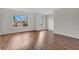 Bright living room featuring hardwood floors and natural light at 1103 Epson Oaks Way, Orlando, FL 32837