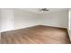 Cozy living space featuring wood-look floors and a ceiling fan at 1103 Epson Oaks Way, Orlando, FL 32837