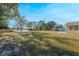 Large backyard with spacious grassy area and water view at 2142 Hainlin Ct, Deltona, FL 32738