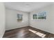 Well-lit bedroom with two windows and wood-look floors at 2142 Hainlin Ct, Deltona, FL 32738