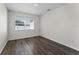 Bright bedroom with dark gray flooring and large window at 2142 Hainlin Ct, Deltona, FL 32738