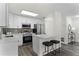 Modern kitchen with white cabinets, quartz countertops, and stainless steel appliances at 2142 Hainlin Ct, Deltona, FL 32738