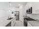 Modern kitchen featuring stainless steel appliances, granite counters, and an island with a sink at 442 Marion Oaks Crse, Ocala, FL 34473
