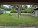A view of the spacious backyard, with privacy fence and mature trees at 10161 Culpepper Ct, Orlando, FL 32836