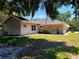 Backyard exterior shows a well maintained yard, landscaping and stucco siding at 10161 Culpepper Ct, Orlando, FL 32836