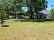 Spacious backyard with covered pavilion, perfect for outdoor entertaining and relaxation with lots of green space at 10161 Culpepper Ct, Orlando, FL 32836