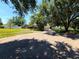 Charming home featuring a large garage and well-manicured lawn with mature trees, enhancing its curb appeal at 10161 Culpepper Ct, Orlando, FL 32836