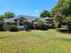 Beautiful home featuring a well-maintained lawn and vibrant landscaping, enhancing its curb appeal at 10161 Culpepper Ct, Orlando, FL 32836