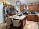 Spacious kitchen with granite countertops, stainless steel appliances, a center island, and plenty of cabinet space at 10161 Culpepper Ct, Orlando, FL 32836