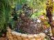 Manicured landscaping featuring a beautiful tropical garden, a perfect outdoor oasis at 10161 Culpepper Ct, Orlando, FL 32836