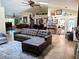 Expansive living room with vaulted ceilings, tile floors, and ample seating perfect for entertaining guests or relaxing at 10161 Culpepper Ct, Orlando, FL 32836